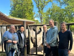 From left to right: Dr. Iris Pollmann, Acting Director of the Department of Psychiatry and Psychotherapy at the UKSH, Campus Kiel, Dr. Gaojianyong Wang, scientist, Max-Planck Institute for Molecular Genetics and Zentrum für Integrative Psychiatrie, Campus Kiel, Dino, Southern white rhinoceros at Schwerin Zoo; Prof. Dr. Franz-Josef Müller, Deputy Director of the Department of Psychiatry and Psychotherapy at the UKSH, Kiel Campus, and Professor at the Faculty of Medicine at Kiel University; Björn Brändl, PhD student, and Christian Rohrandt, PhD student, Zentrum für Integrative Psychiatrie, Campus Kiel